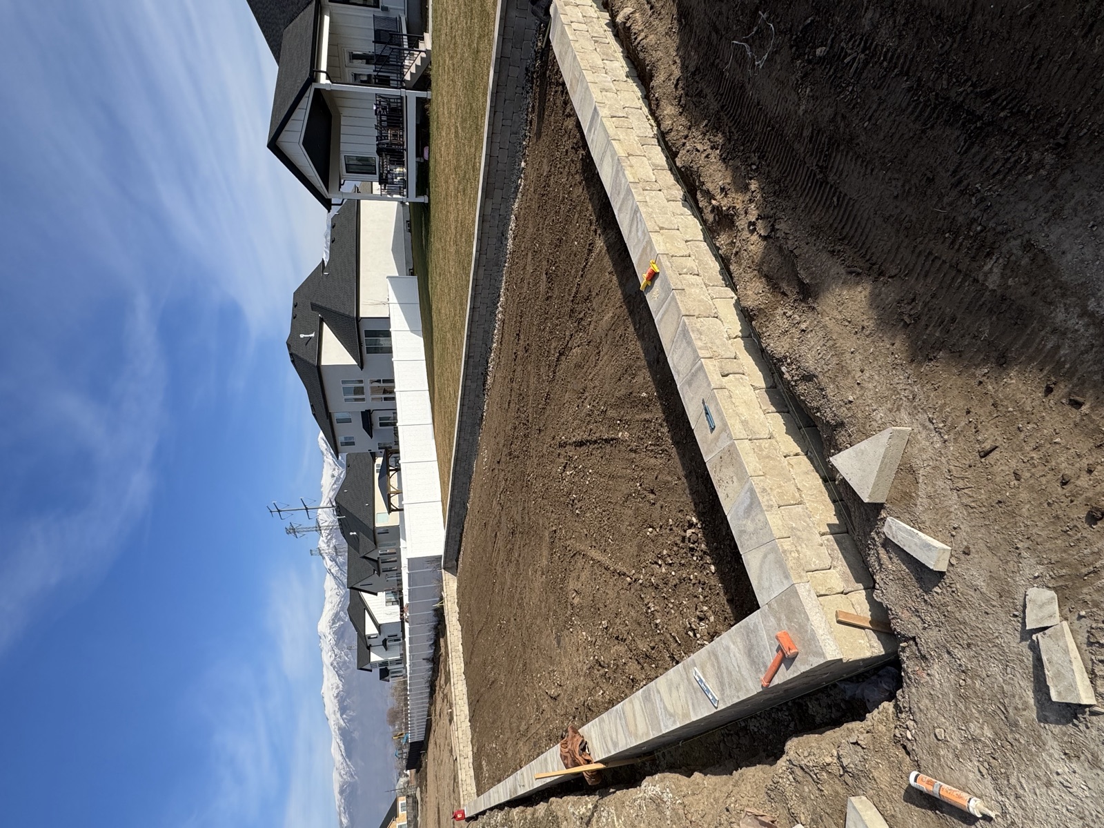 Block retaining wall under construction — Sol Scapes Utah