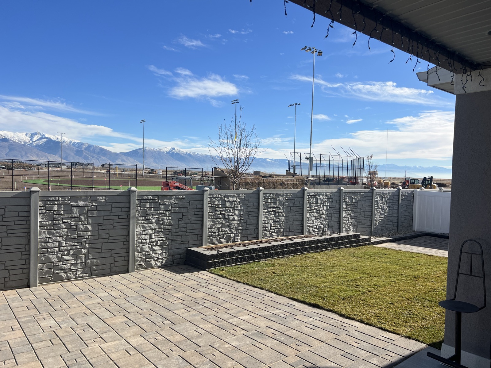 Paver patio installation with mountain view in Utah by Sol Scapes